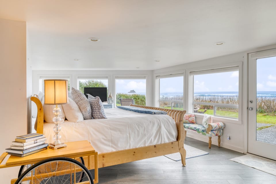Primary bedroom features a king bed, Pacific views, and an ensuite bathroom.