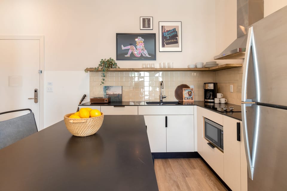 Primary bedroom features a king bed and ensuite bathroom (B203).