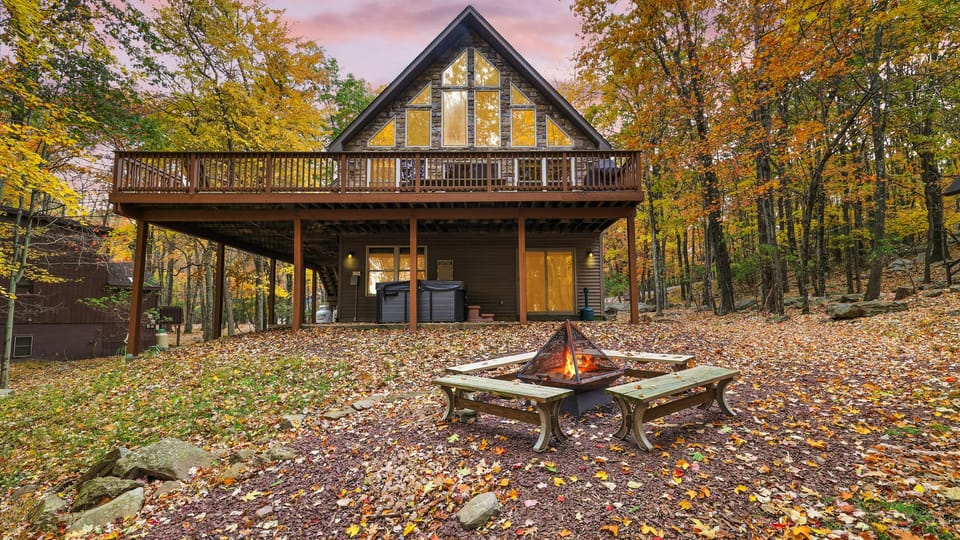 Charming exterior under the golden sky featuring a fire pit.