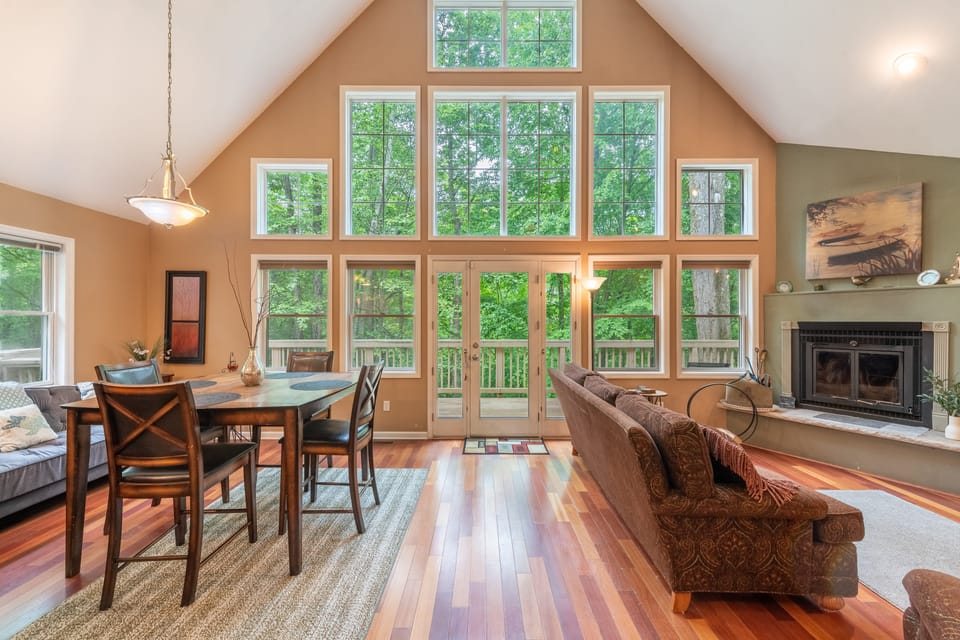 Expansive windows fill the space with natural light. Upgraded with a propane fireplace.