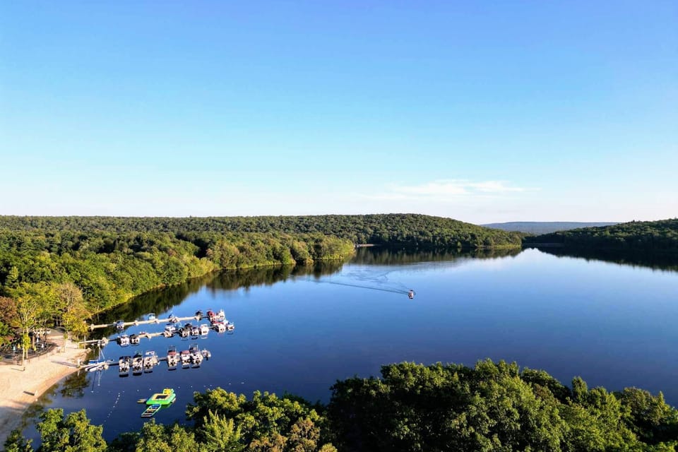 Aerial view of nearby lake and surrounding forest landscape