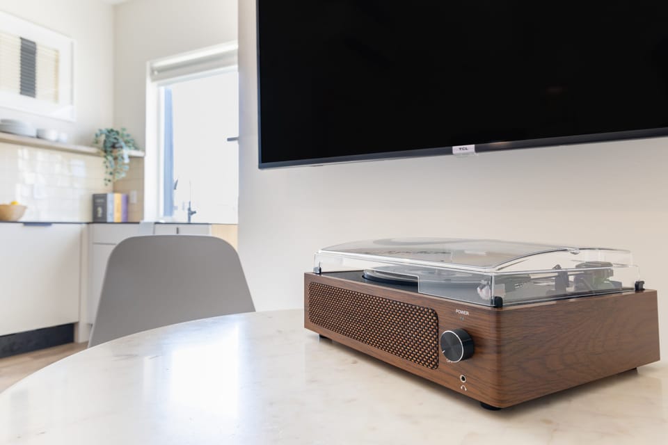 Flatscreen television and record player for your favorite shows and tunes.