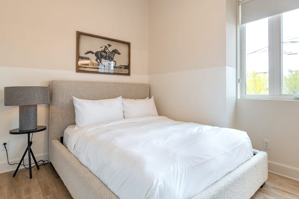 Bedroom 1 features a queen bed.
