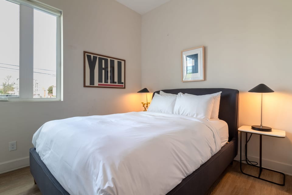 Bedroom 2 features a queen bed.