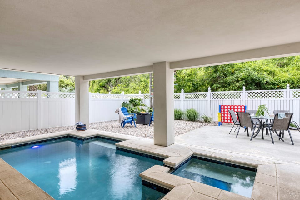 Private yard with pool, hot tub, firepit, and al fresco dining.