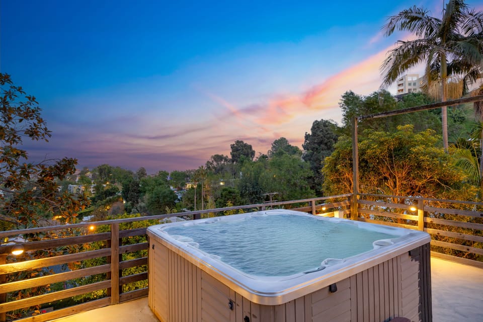 Take a dip in this refreshing hot tub with city views.