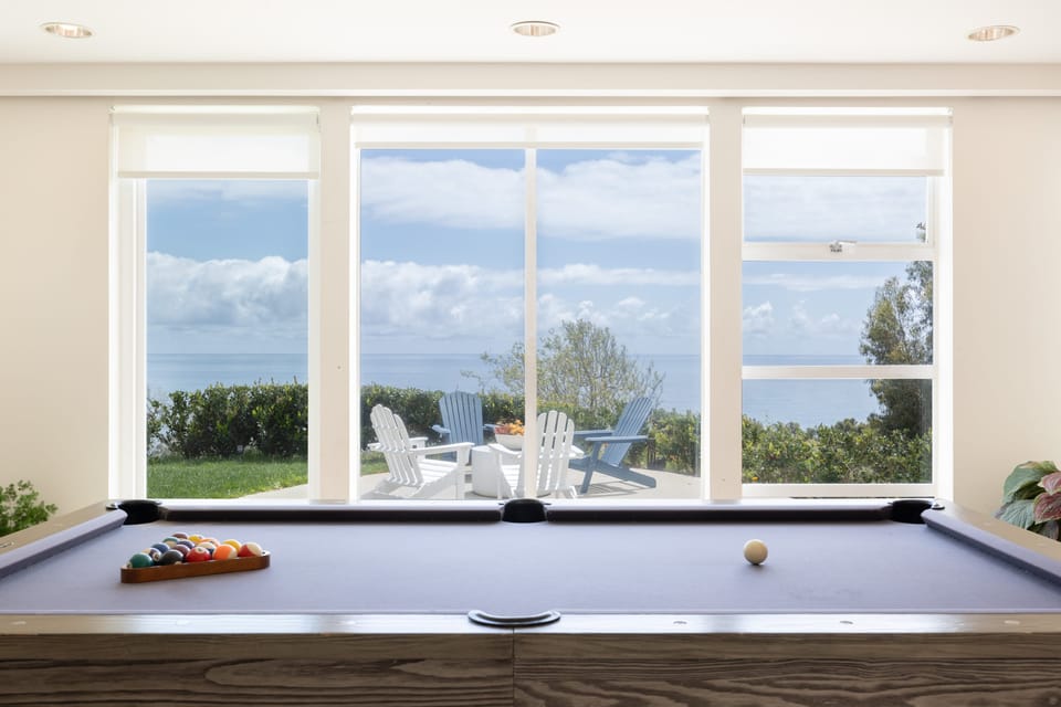 Socialize in the game room with a pool table and large flat-screen TV.