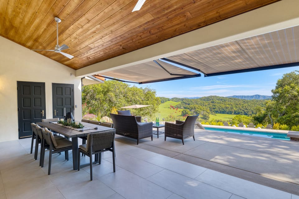 Enjoy alfresco dining on the covered patio with stunning views.
