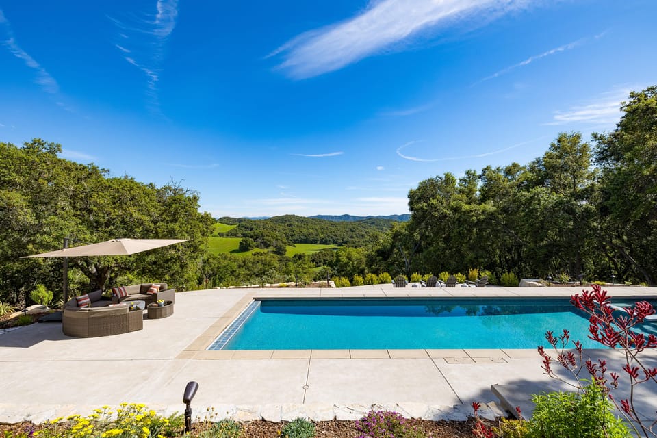 Relax poolside and soak up the sun in the ample outdoor living spaces.
