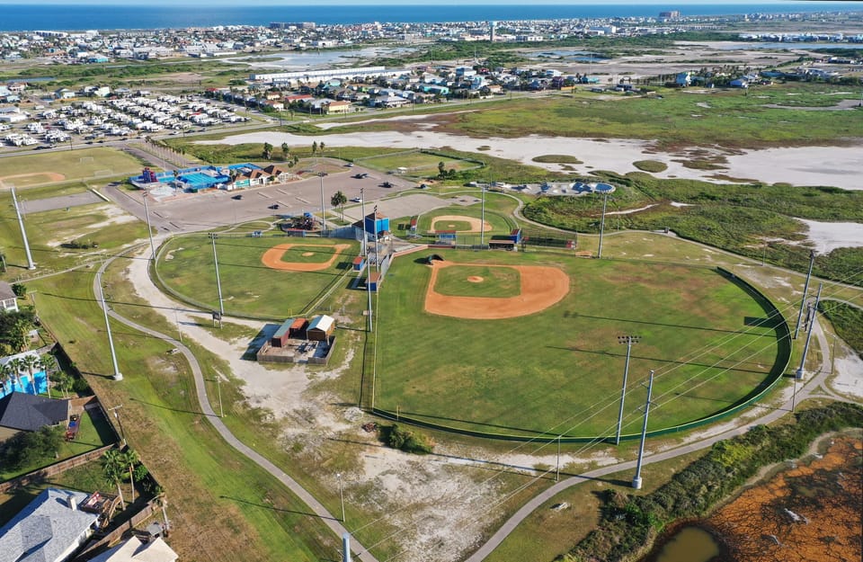 Feel the thrill of the game as you cheer for your team under the stadium lights.