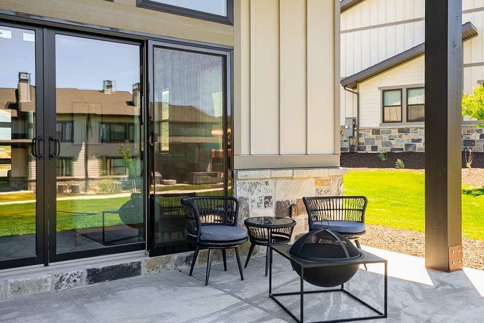 Patio with seating and fire pit for a lazy afternoon or cozy evening.