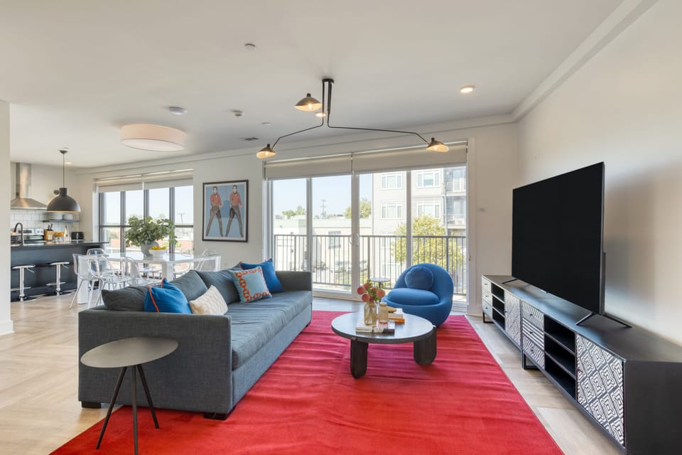 Living room off the balcony featuring a sleeper sofa.