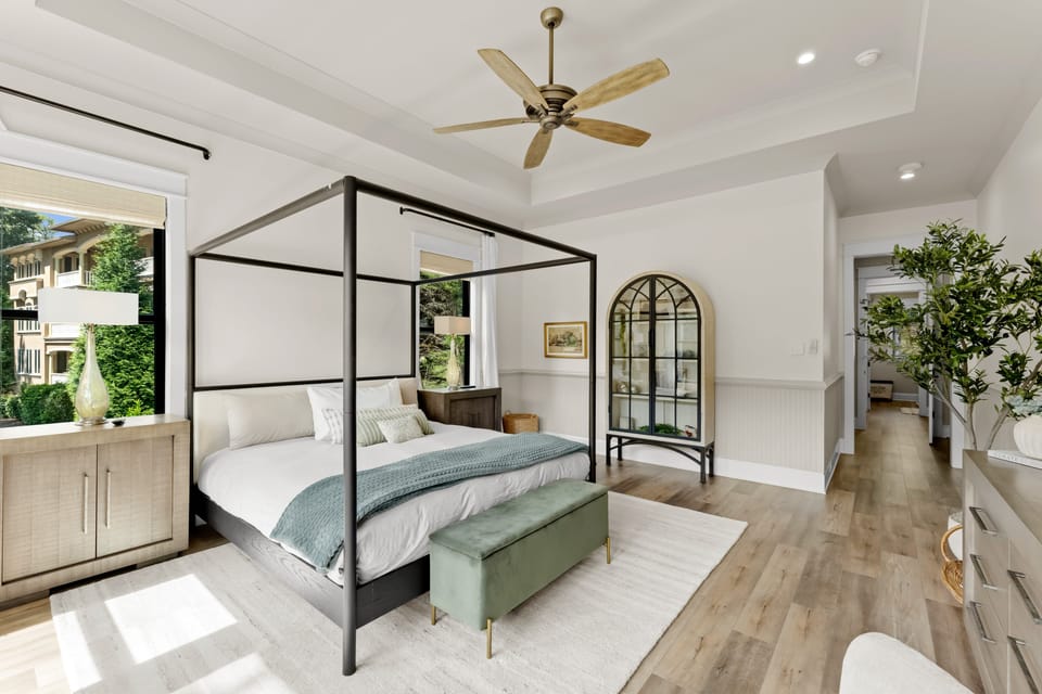 Primary bedroom with King bed, TV lake views and gorgeous bath!
