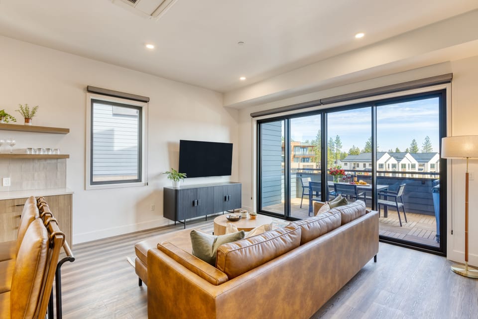 The primary bedroom features a king bed, ensuite bathroom and access to the balcony.