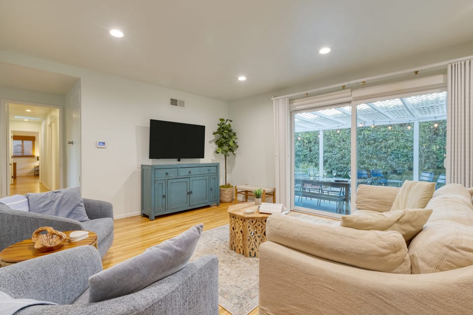 Spacious living area with chic, coastal-inspired decor.