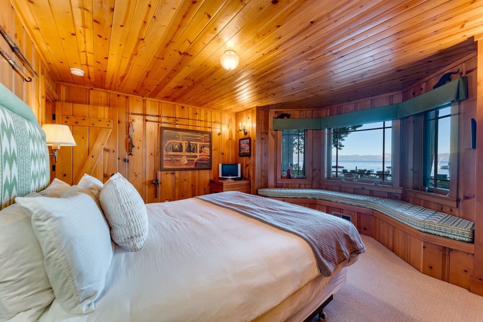 Bedroom 4 is located in the main house and features a king bed with an ensuite bathroom.