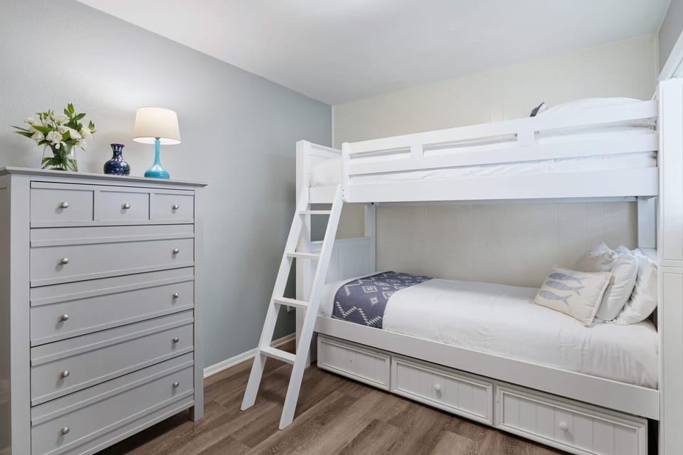 Bedroom 2 features a twin-over-twin bunk bed.