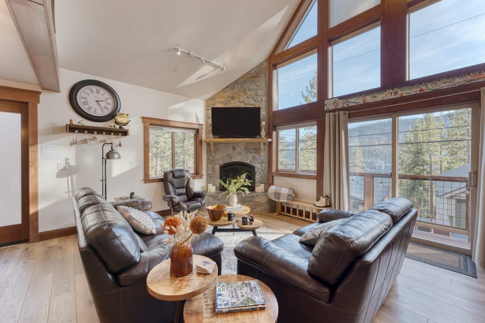 Spacious living area with floor-to-ceiling windows.