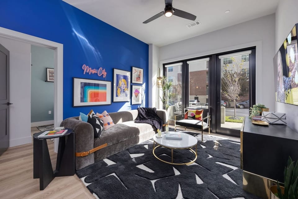 Primary bedroom features a king bed, TV, and ensuite bathroom.
