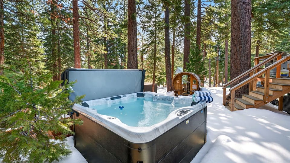 Private outdoor hot tub tucked among the trees—perfect for soaking after a day of mountain adventures.