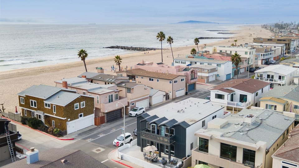 The living room features a large sectional sofa.