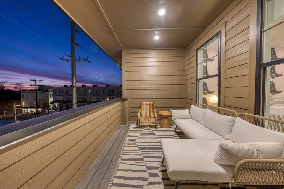 Covered balcony at night.
