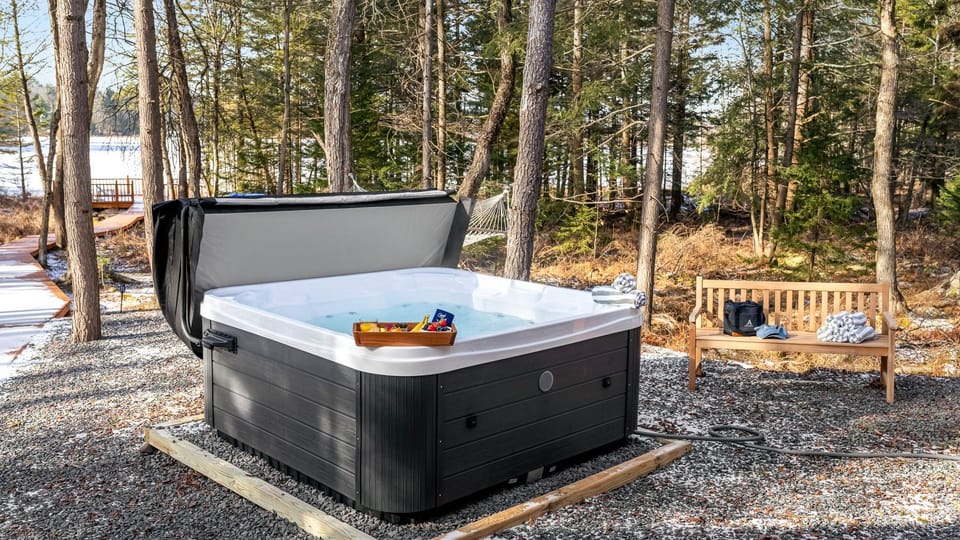 Unwind in the hot tub tucked among the trees, offering a peaceful spot to relax after a day exploring the Smoky Mountains.