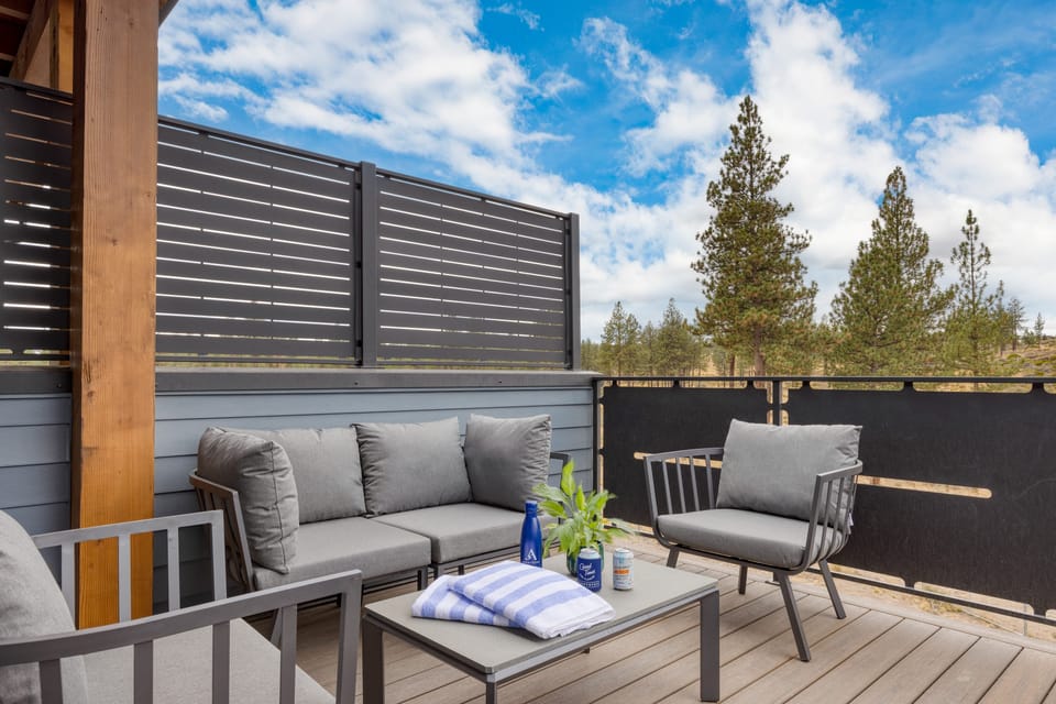 Private hot tub with sunset views over the pines.