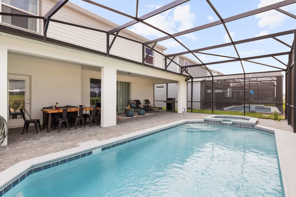 Relax and enjoy peace of mind in the fenced pool area.