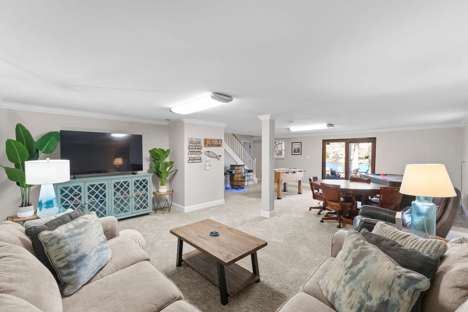 Lower level game room- foosball, air hockey, card table, large TV &amp; sectional.