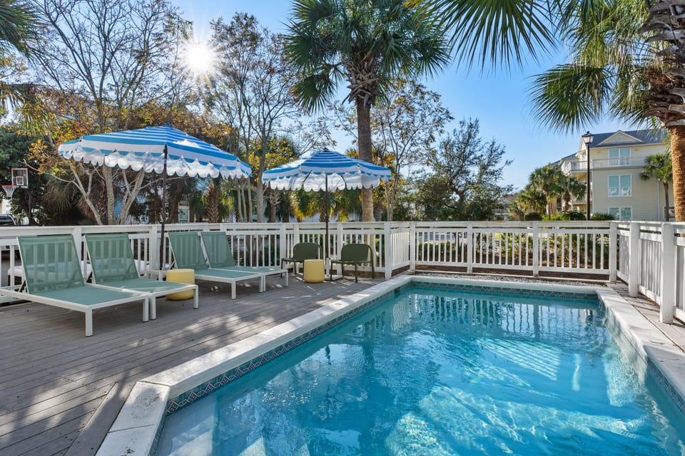 Relax and unwind on the comfortable loungers by the sparkling pool.