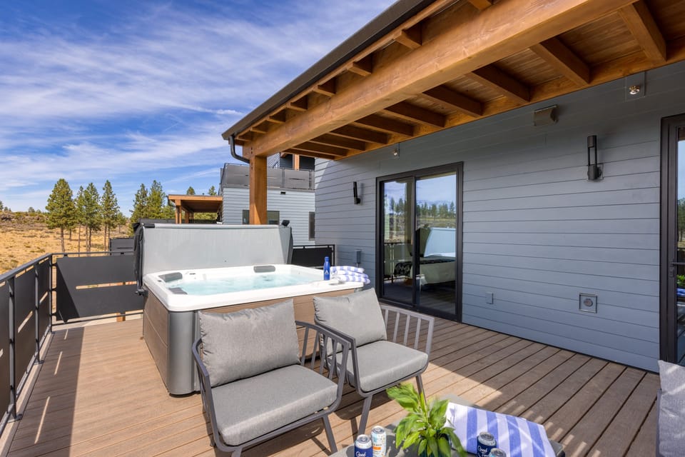 Private deck with hot tub and seating.