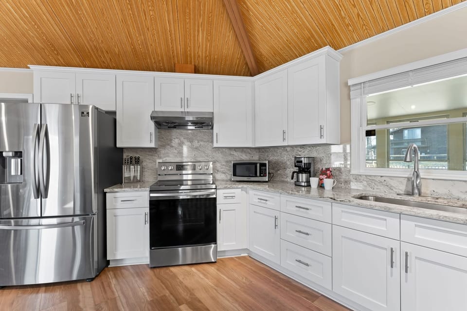 Fully stocked kitchen with new counter tops &amp; appliances.