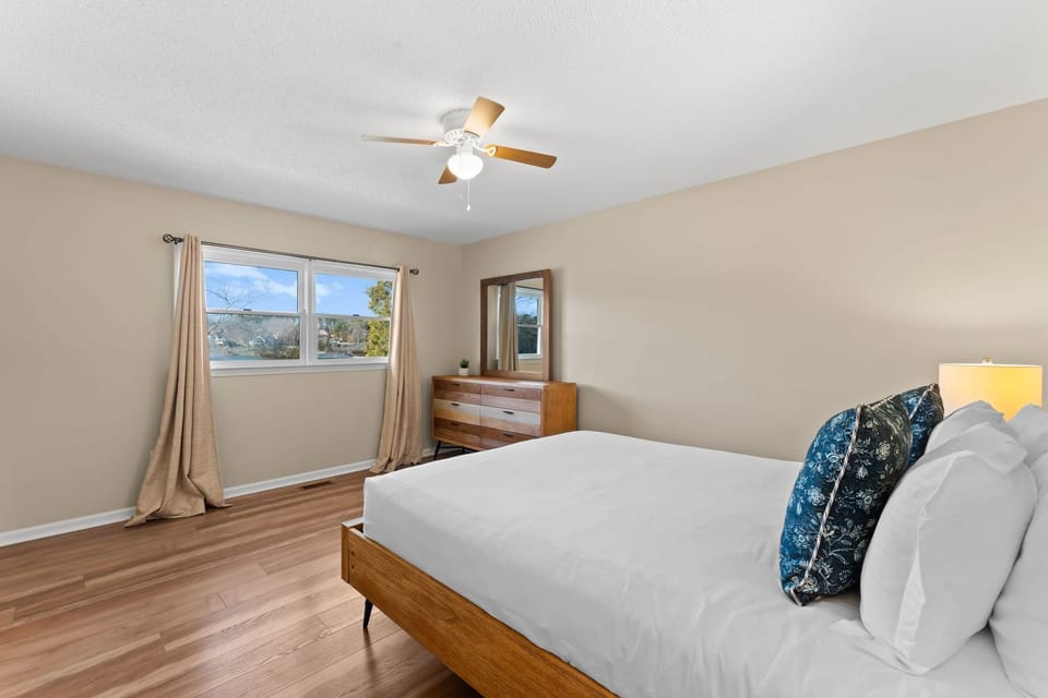 Main level queen bedroom with lake views.
