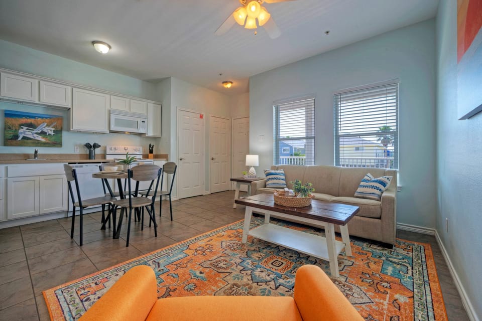 A bright and airy living room features a cozy sleeper sofa for extra guests. (205)