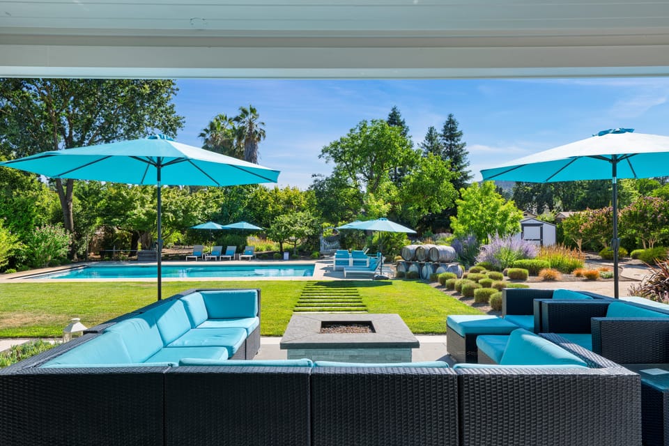 Outdoor lounge area with a fire pit.