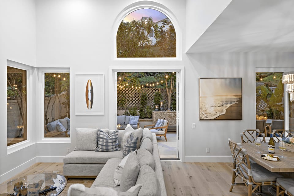 Large windows bring in natural light and offer serene outdoor views.