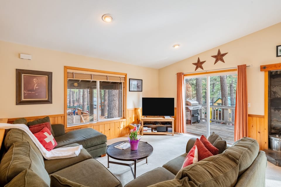 Cozy living room with deck access—perfect for relaxing indoors or stepping out to enjoy the fresh air!