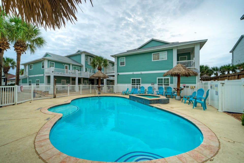 Unwind in the inviting communal pool and spa area.