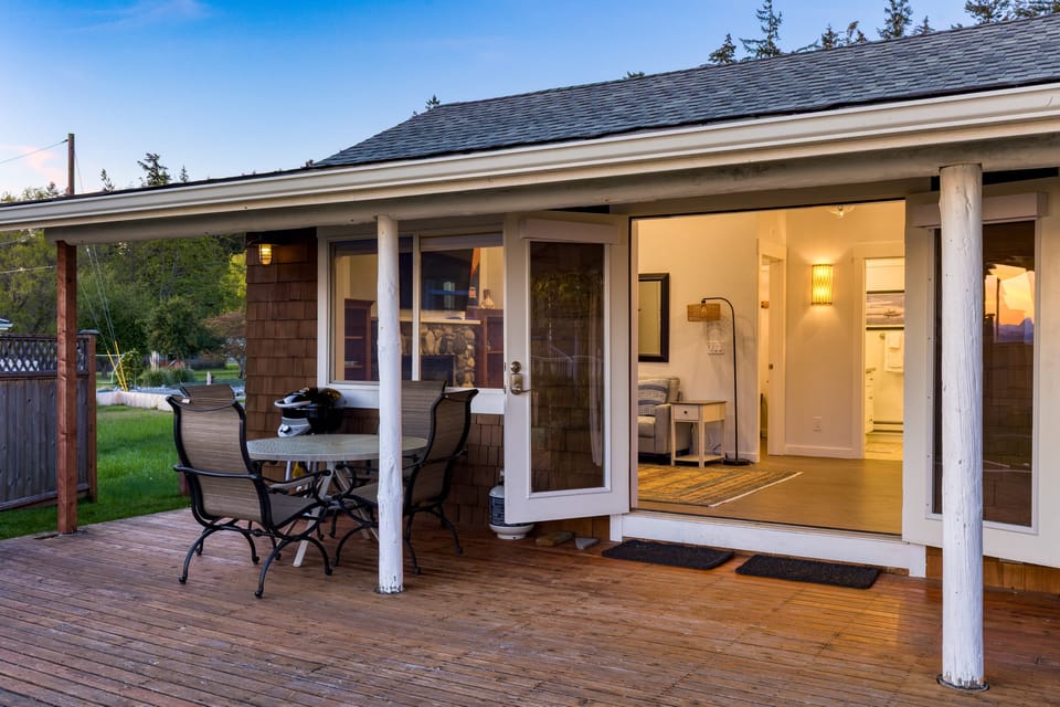 Outdoor patio with a BBQ grill and dining table—perfect for alfresco meals.