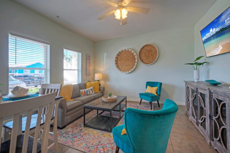 The inviting living room features a sleeper sofa (Unit 103)