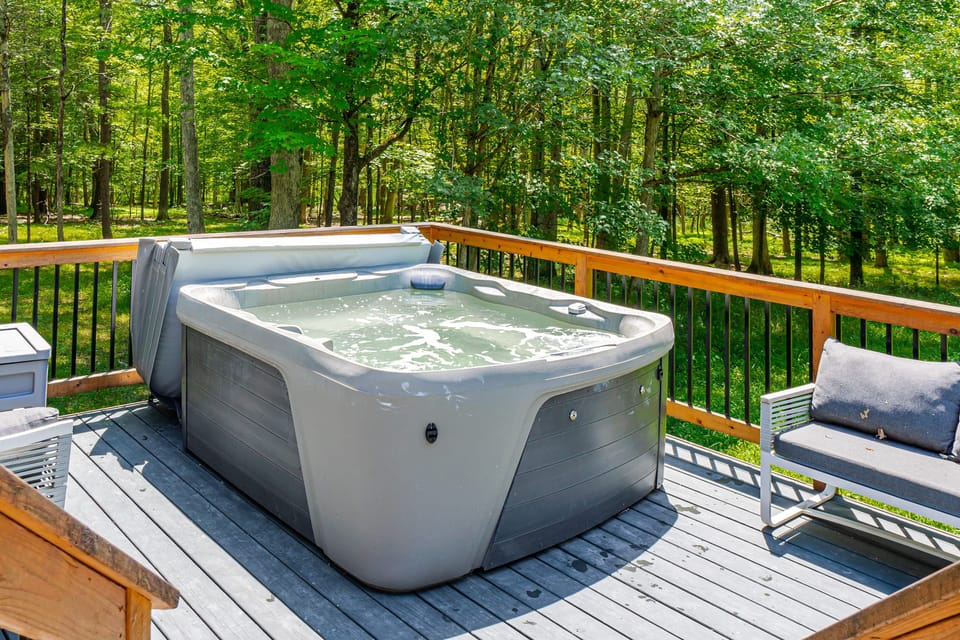 Unwind in this private outdoor hot tub with a scenic view.