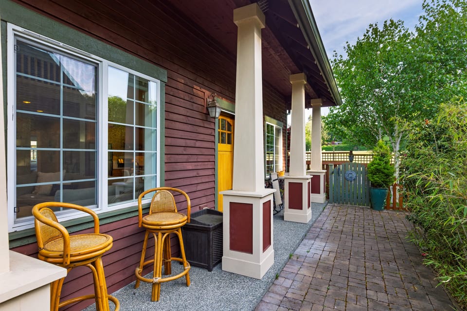 Stools and zero-gravity chairs on the front porch for relaxing and enjoying the view.