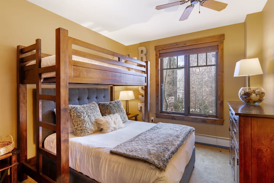 Bedroom 2 features a twin-over-queen bunk bed.