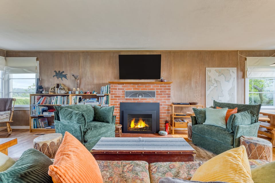 Cozy living room with fireplace and comfortable seating.