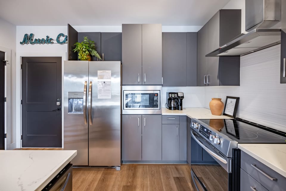 Sleek modern kitchen with stainless steel appliances.