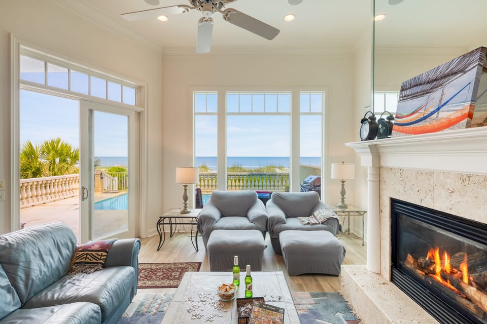 Ocean views from the living room, complete with comfy seating, a Smart TV, and a cozy fireplace for relaxing in style.