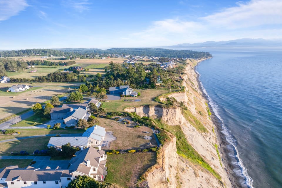 Waterfront home with dramatic bluff-top views of the coastline.