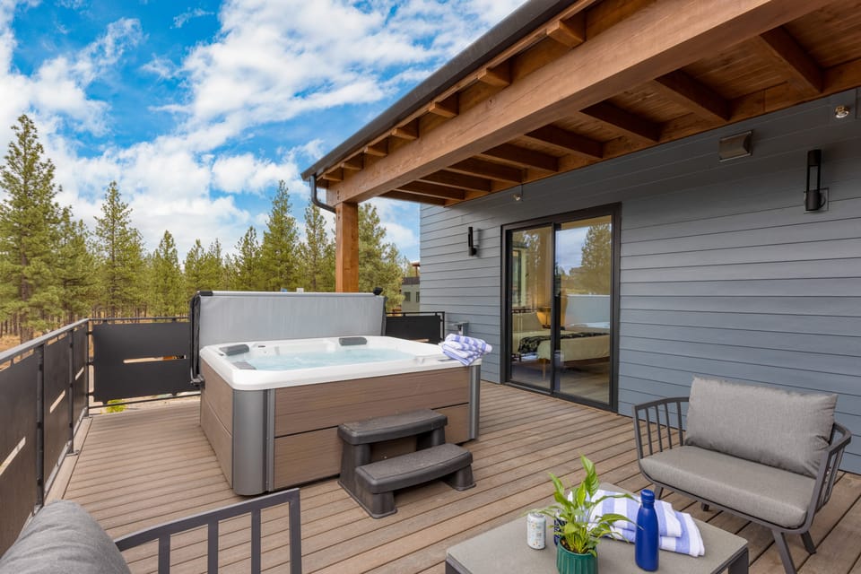 Private deck with hot tub and seating.