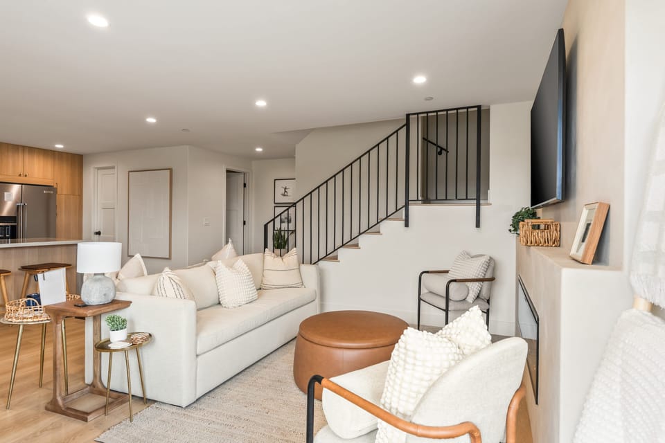 Inviting living room with sleeper sofa, a fireplace, and TV—perfect for unwinding after a day of adventure.